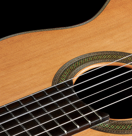 The soundboard and rosette of a 2024 Teodoro Perez "Concierto" classical guitar made of cedar and Indian rosewood.