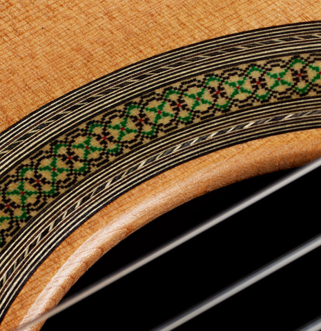 Close-up detail of the rosette of a 2025 Teodoro Perez "Concierto" classical guitar made of cedar and Indian rosewood.
