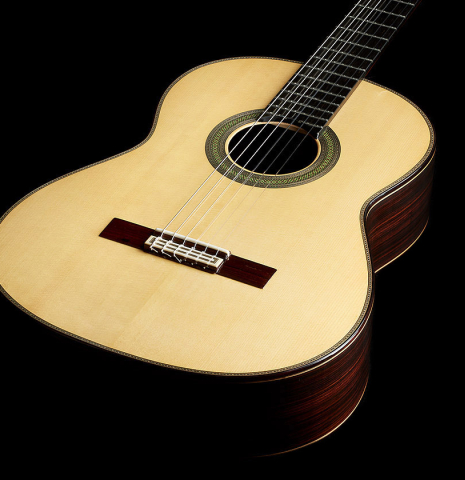 The soundboard of a 2024 Teodoro Perez "Concierto" classical guitar made of spruce and Indian rosewood
