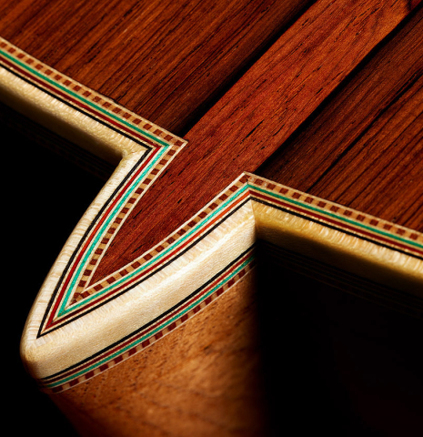 The heel, back binding and purfling of a 2025 Teodoro Perez "Especial" classical guitar made of spruce and African rosewood.