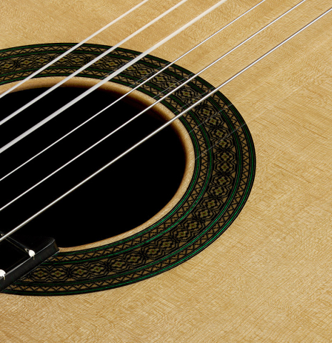 Detailed closeup of the rosette of a 2025 Teodoro Perez "Especial" classical guitar made of spruce and African rosewood.