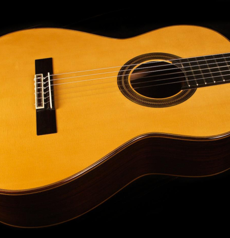 The soundboard and side of a 2013 Teodoro Perez "Madrid" classical guitar made of spruce and Indian rosewood