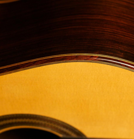 The top binding and purfling of a 2013 Teodoro Perez "Madrid" classical guitar made of spruce and Indian rosewood