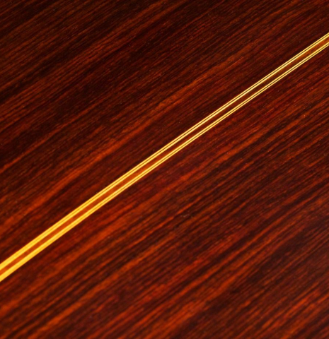 The back center seam of a 2013 Teodoro Perez "Madrid" classical guitar made of spruce and Indian rosewood