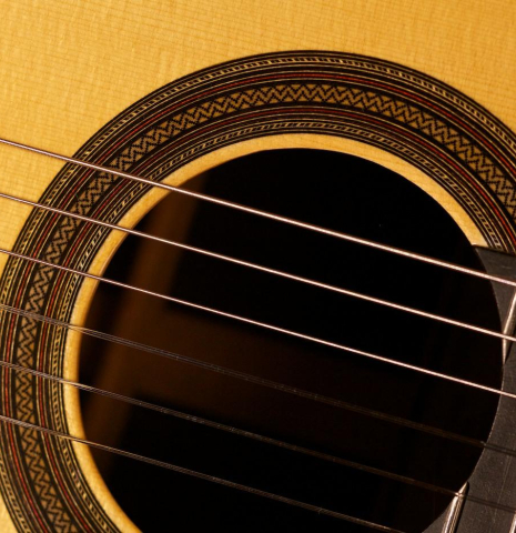 The top and rosette detail of a 2013 Teodoro Perez "Madrid" classical guitar made of spruce and Indian rosewood