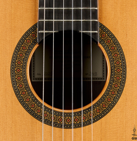 The rosette of a 2025 Teodoro Perez "Madrid" classical guitar made of cedar and Indian rosewood