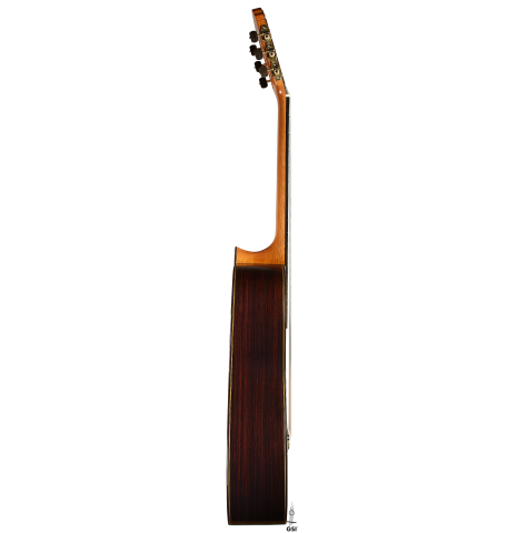The side of a 2025 Teodoro Perez "Madrid" classical guitar made of cedar and Indian rosewood