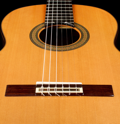 The soundboard and bridge of a 2025 Teodoro Perez "Madrid" classical guitar made of cedar and Indian rosewood