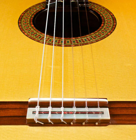 This is the bridge and saddle of a 2015 Teodoro Perez &quot;Especial&quot; classical guitar made with spruce and cocobolo