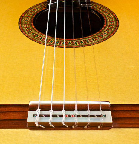 This is the bridge and saddle of a 2015 Teodoro Perez &quot;Especial&quot; classical guitar made with spruce and cocobolo