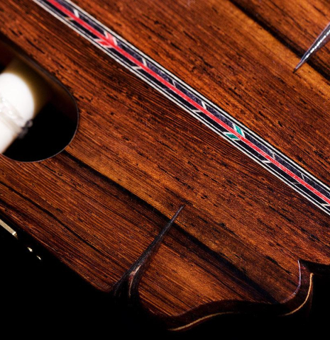 The headstock veneer and purflings of a 2020 Teodoro Perez "Especial Aniversario" classical guitar made of spruce and cocobolo