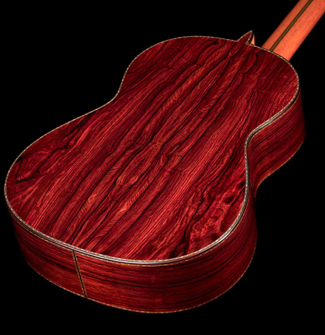 The cocobolo back of a 2022 Teodoro Perez &quot;Especial&quot; classical guitar with a spruce top