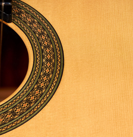 The rosette and soundboard of a 2022 Teodoro Perez &quot;Especial&quot; classical guitar made of spruce and cocobolo