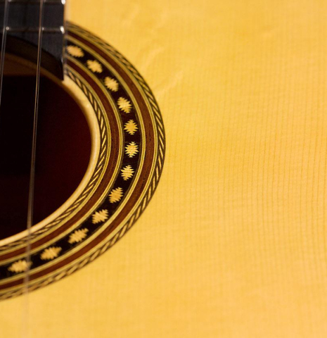 The soundboard and rosette of a 2020 Erez Perelman classical guitar made of spruce and cypress