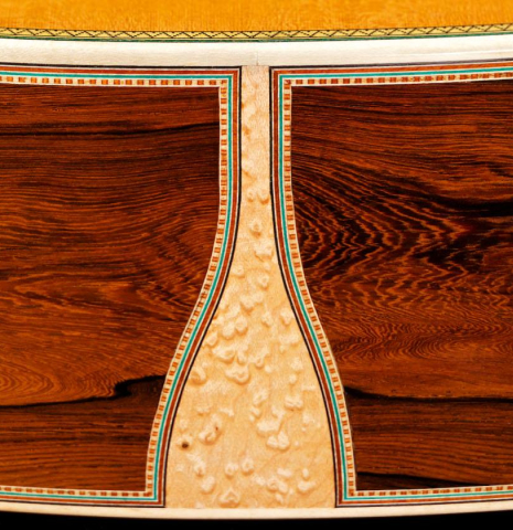 The sides at the foot with maple inlay of a 2015 Teodoro Perez "Especial Maple" classical guitar made of cedar and CSA rosewood