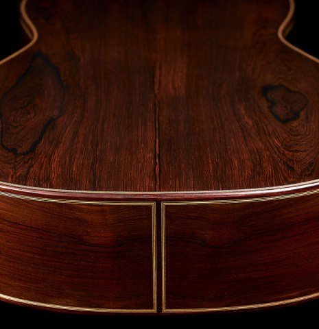 The back and sides at the foot of a 2024 Teodoro Perez "Antigua" classical guitar made of spruce and African rosewood