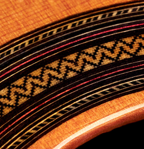 The close-up of the rosette of a 2022 Teodoro Perez "Estudio C-650" model made with cedar and Indian rosewood