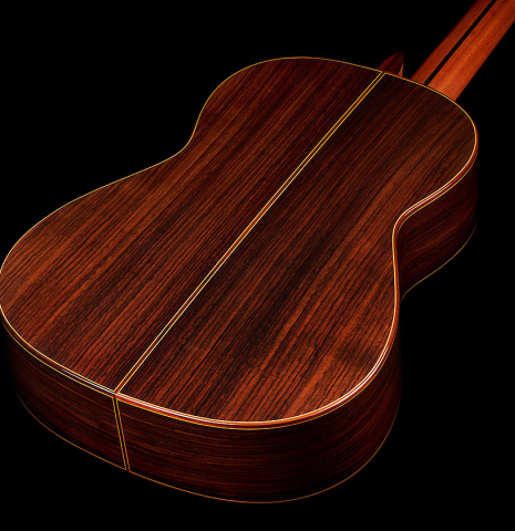 The back and sides at the foot of a 2024 Teodoro Perez "Estudio C-650" classical guitar made of cedar and Indian rosewood.