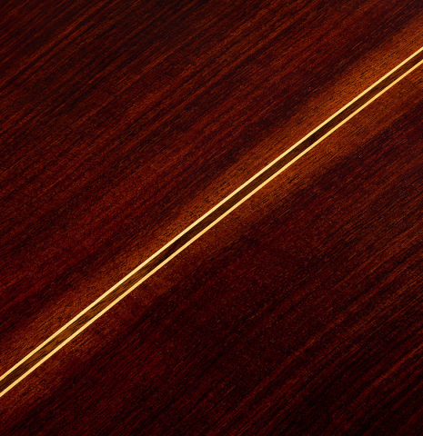 The back center seam of a 2025 Teodoro Perez "Estudio C-650" classical guitar made of cedar and Indian rosewood.
