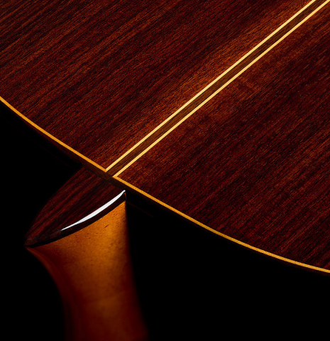The heel, back binding and purfling of a 2025 Teodoro Perez "Estudio C-650" classical guitar made of cedar and Indian rosewood.