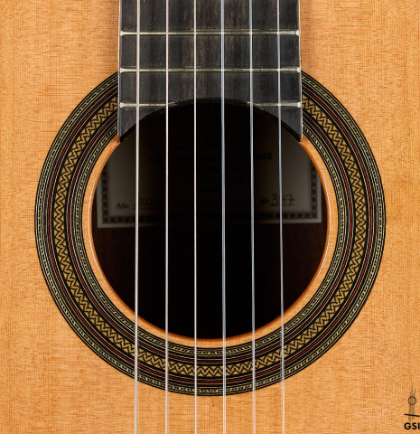 The rosette of a 2025 Teodoro Perez "Estudio C-650" classical guitar made of cedar and Indian rosewood.