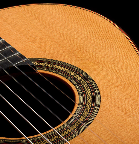 The soundboard and rosette of a 2025 Teodoro Perez "Estudio C-650" classical guitar made of cedar and Indian rosewood.