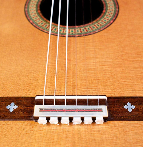 The top, bridge, tie-block and saddle of a 2016 Teodoro Perez "50th Anniversary" classical guitar made of cedar and CSA rosewood