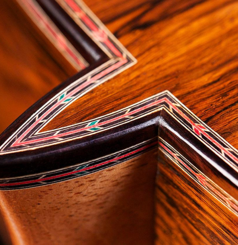 The heel and back purflings of a 2016 Teodoro Perez "50th Anniversary" classical guitar made of cedar and CSA rosewood