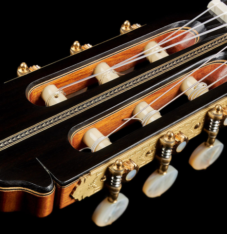 The headstock and tuning machines of a 2024 Teodoro Perez "Especial" classical guitar made of spruce and African ebony