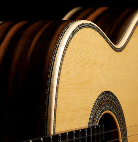 The side and soundboard of a 2024 Teodoro Perez "Especial" classical guitar made of spruce and African ebony