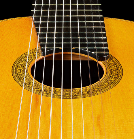 The soundboard of a 2006 Teodoro Perez "Maestro 10-string" classical guitar made of spruce and African rosewood