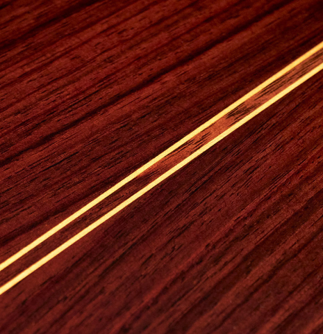 The back of a 2023 Teodoro Perez &quot;Estudio C-650&quot; classical guitar made of spruce and Indian rosewood.