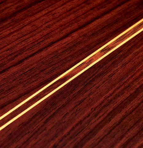 The back of a 2023 Teodoro Perez "Estudio C-650" classical guitar made of spruce and Indian rosewood.