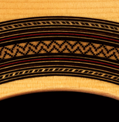 The rosette of a 2023 Teodoro Perez "Estudio C-650" classical guitar made of spruce and Indian rosewood.