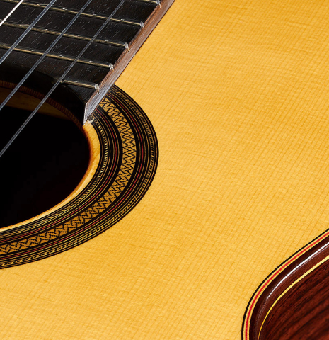 The soundboard of a 2024 Teodoro Perez "Estudio C-650" classical guitar made of spruce and Indian rosewood.