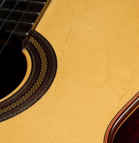 The soundboard and rosette detail of a 2025 Teodoro Perez "Estudio C-650" classical guitar made of spruce and Indian rosewood
