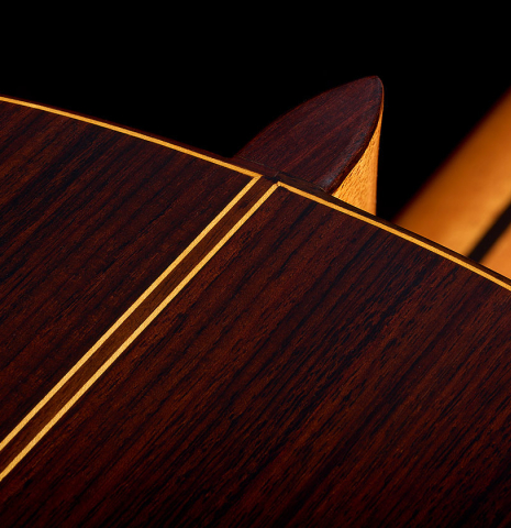 The heel, back binding and purfling of a 2026 Teodoro Perez "Estudio C-650" classical guitar made of spruce and Indian rosewood