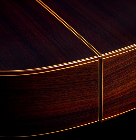 The back and sides at the foot of a 2026 Teodoro Perez "Estudio C-650" classical guitar made of spruce and Indian rosewood