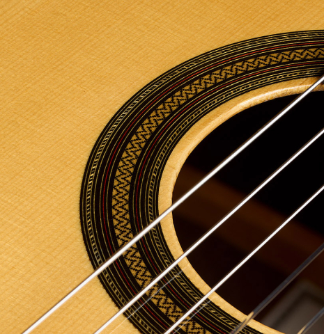 The top and rosette detail of a 2026 Teodoro Perez "Estudio C-650" classical guitar made of spruce and Indian rosewood