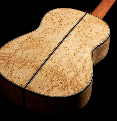 The back and sides of a 2024 Teodoro Perez "1884 Torres - La Emperatriz" classical guitar made of spruce and maple