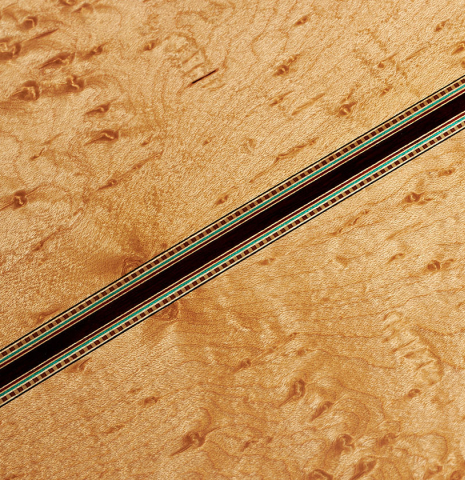 Closeup of back center seam of a 2024 Teodoro Perez "1884 Torres - La Emperatriz" classical guitar made of spruce and maple
