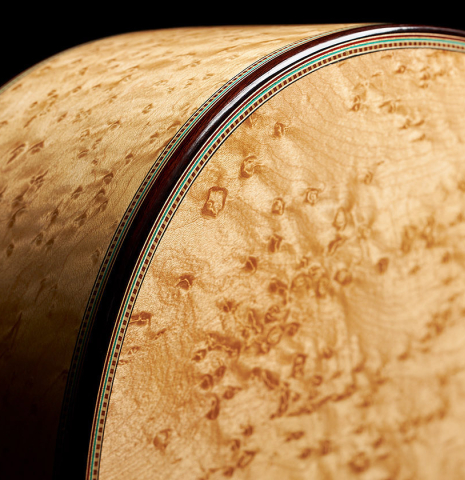 The back, sides and binding of a 2024 Teodoro Perez "1884 Torres - La Emperatriz" classical guitar made of spruce and maple