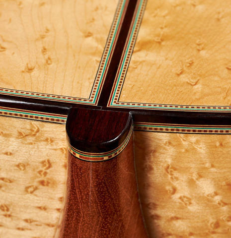 The heel and back binding of a 2024 Teodoro Perez "1884 Torres - La Emperatriz" classical guitar made of spruce and maple