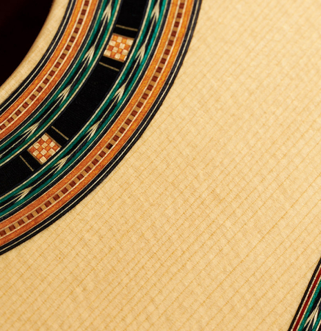 The soundboard and rosette detail of a 2024 Teodoro Perez "1884 Torres - La Emperatriz" classical guitar made of spruce and maple