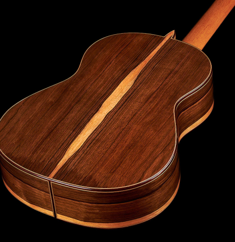 The back and sides of a 2023 Sergio Perez "Segovia" model of classical guitar made of cedar and green ebony. 