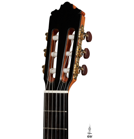 The headstock of a 2023 Sergio Perez "Segovia" model of classical guitar made of cedar and green ebony. 