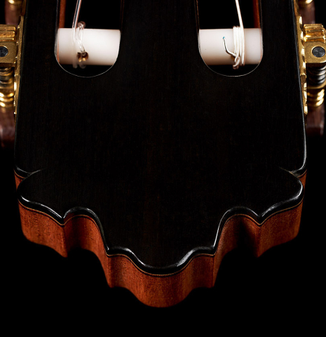 The headstock and tuning machines of a 2023 Sergio Perez "Segovia" model of classical guitar made of cedar and green ebony. 