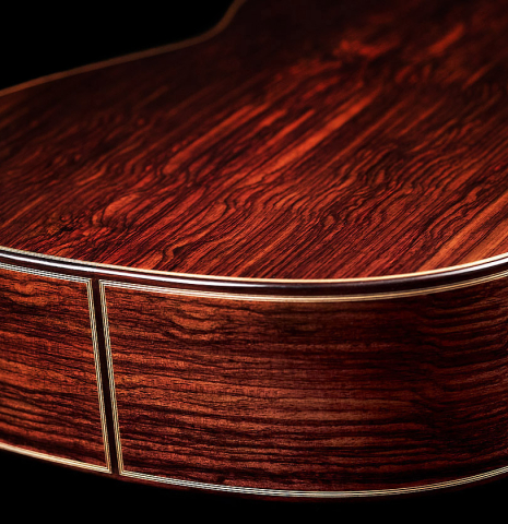 The lower bout of a 2023 Teodoro Perez "Antigua" classical guitar made of cedar and Indian rosewood.