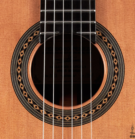 The rosette of a 2023 Teodoro Perez "Antigua" classical guitar made of cedar and Indian rosewood.