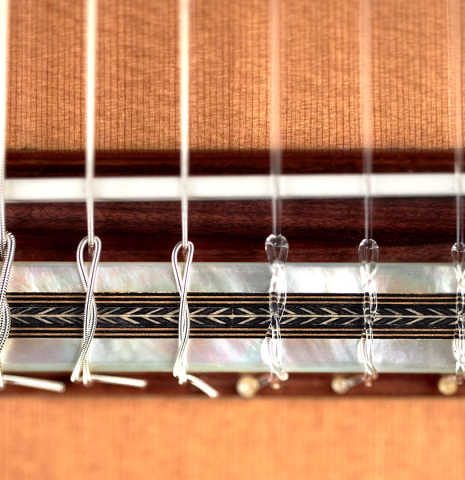 Tie-block, bridge and saddle of a 2023 Teodoro Perez "Especial" classical guitar made of cedar and pau ferro